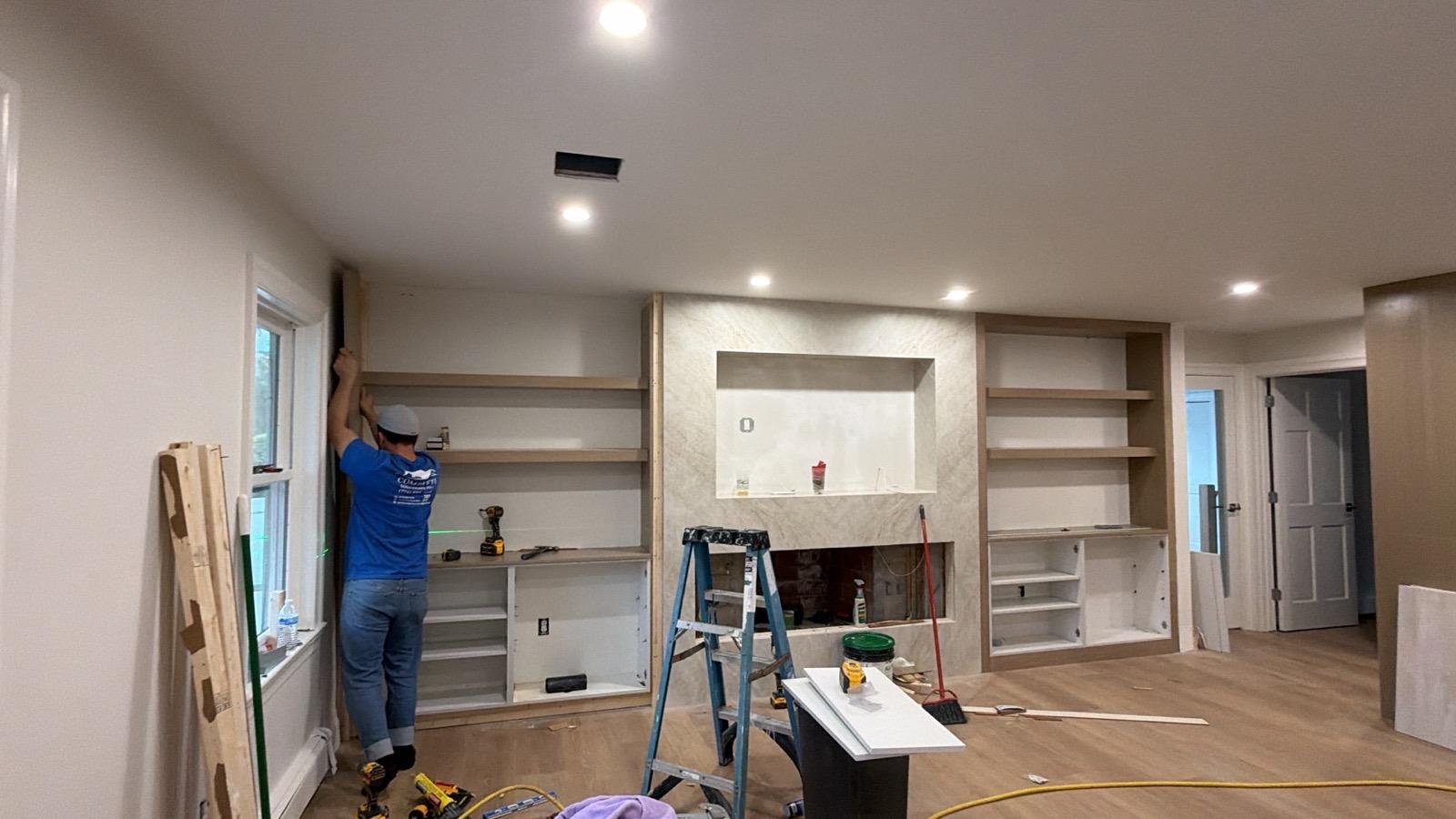 Luciano installing built-in shelving